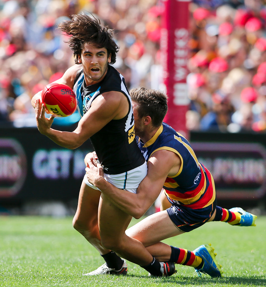 AFL 2016 Rd 02 - Adelaide v Port Adelaide ADELAIDE, AUSTRALIA - APRIL 2: Chad Wingard of the Power tackled by Paul Seedsman of the Crows during the 2016 AFL Round 02 match between the Adelaide Crows and Port Adelaide Power at the Adelaide Oval, Adelaide on April 2, 2016. (Photo by /AFL Media)